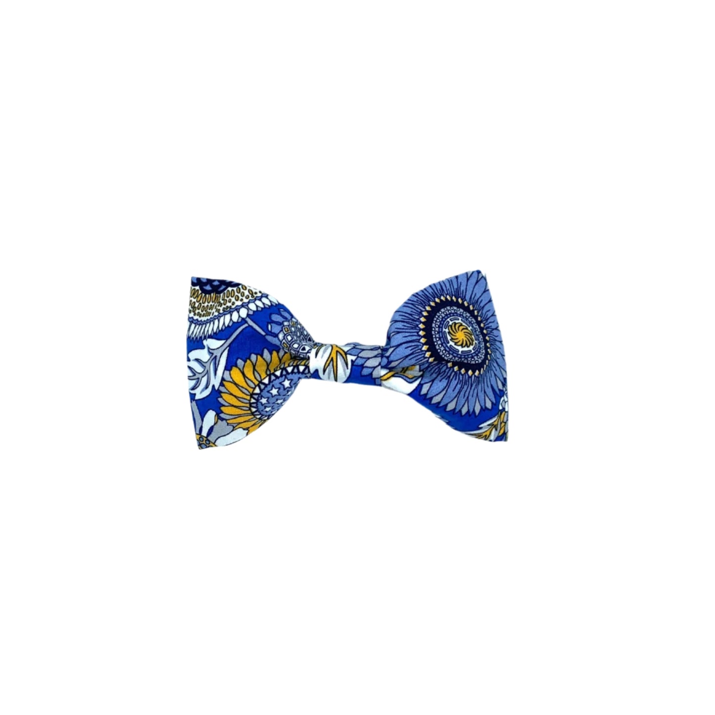 A dog bow tie with a blue background featuring a multicolored floral pattern.