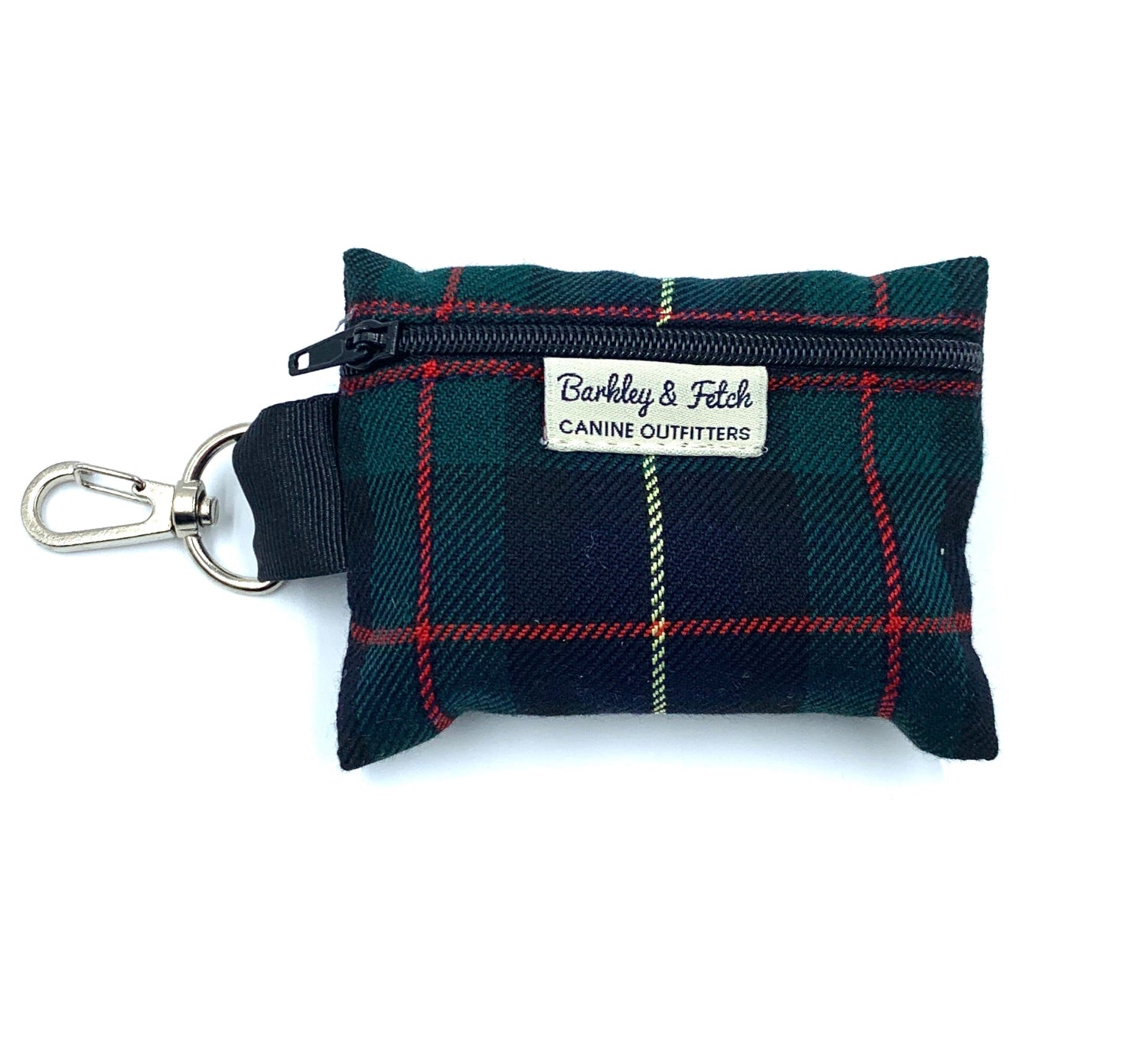 A green and navy tartan print poo bag holder with a metal clip and a brand label reading Barkley and Fetch - CANINE OUTFITTERS'.