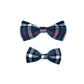Two plaid bow ties on a white background