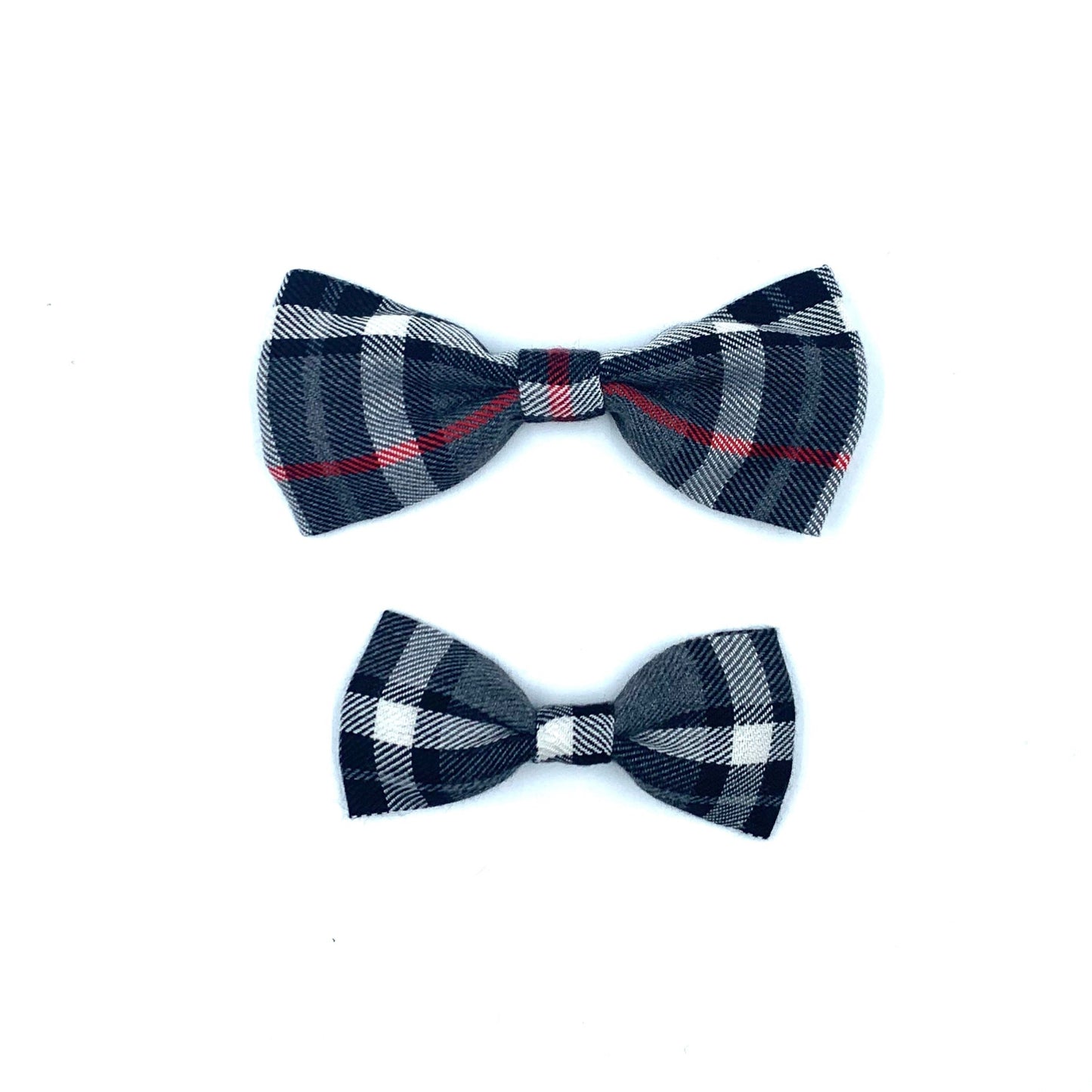 Two plaid bow ties on a white background