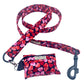 Heart-patterned dog leash and pouch set on a white background