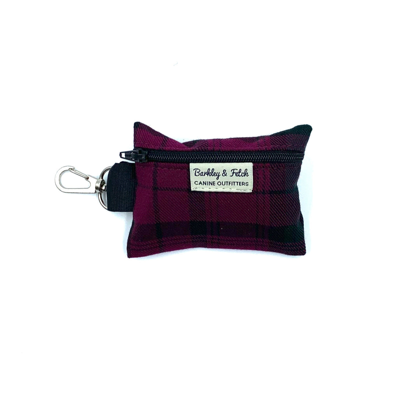 A Mulberry Tartan poo bag holder with a clip, designed to hold rolls of poo bags. It appears to be solid purple in color with a tartan pattern, and has a label that reads 'Barkley & Fetch'.