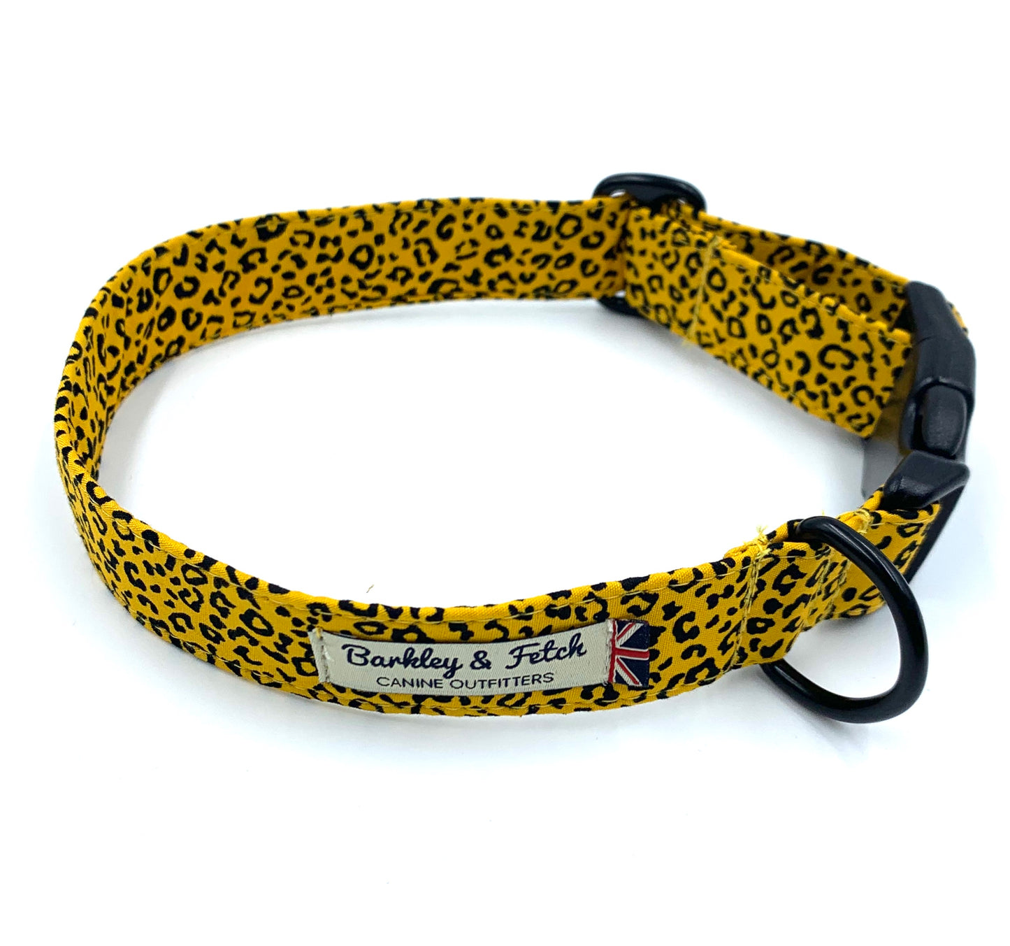 A yellow dog collar with black leopard print design, featuring a secure clip fastening and a heavy duty d-ring.
