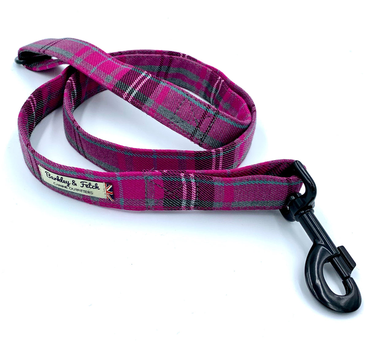 A pink and grey tartan pattern dog lead with a metal trigger hook and a D-ring on the handle.