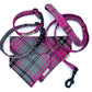 Plaid dog collar, harness, and leash set on a white background